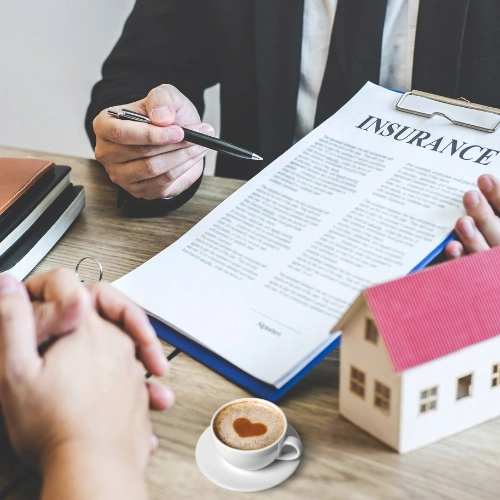An advisor carefully guiding a client through their insurance options, reflecting our commitment to providing clear and caring service.